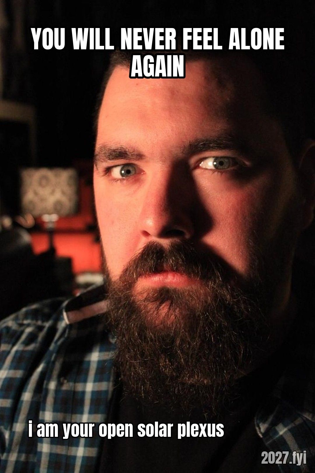 A bearded man in dim light. YOU WILL NEVER FEEL ALONE AGAIN / i am your open solar plexus