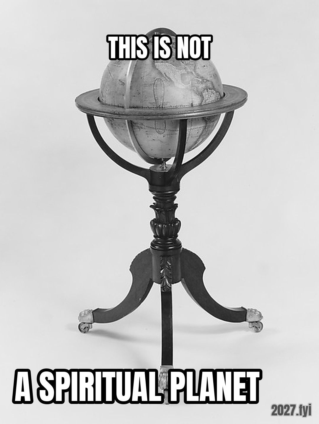 An 1828 terrestrial globe on a stand. THIS IS NOT / A SPIRITUAL PLANET